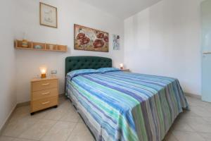 Postel nebo postele na pokoji v ubytování Deliziosi Appartamenti Sul Mare