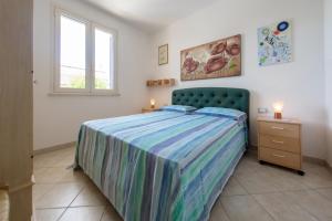 Postel nebo postele na pokoji v ubytování Deliziosi Appartamenti Sul Mare
