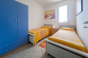 Postel nebo postele na pokoji v ubytování Deliziosi Appartamenti Sul Mare