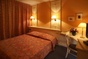 Letto o letti in una camera di Hotel Gruber