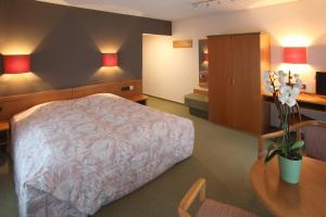 Letto o letti in una camera di Hotel Gruber