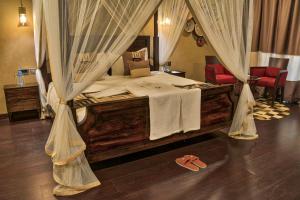 Voodi või voodid majutusasutuse Speke Resort and Conference Center toas