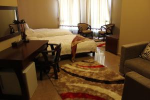 Postel nebo postele na pokoji v ubytování Kanaan Group Hotel