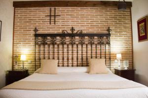 מיטה או מיטות בחדר ב-La Posada de Manolo