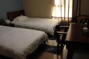 Postel nebo postele na pokoji v ubytování Kanaan Group Hotel