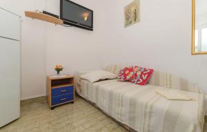 Katil atau katil-katil dalam bilik di Apartmani Dokoza