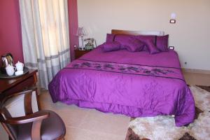 Postel nebo postele na pokoji v ubytování Kanaan Group Hotel