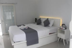 Postel nebo postele na pokoji v ubytování Casa Blanca Gili Air