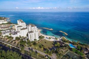 an aerial view of a resort near the ocean at Luxury 2BR Home facing Beach w/Pool Montego Bay #3 in Montego Bay