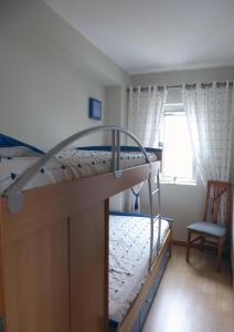 Ένα ή περισσότερα κρεβάτια σε δωμάτιο στο Near Beach Apartment