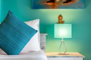 A bed or beds in a room at Hacienda Fisherman's Village Koh Samui
