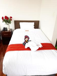 Postel nebo postele na pokoji v ubytování Pumas Cusco Hotel