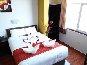 Postel nebo postele na pokoji v ubytování Pumas Cusco Hotel