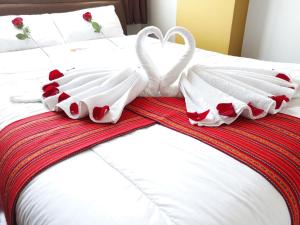 Postel nebo postele na pokoji v ubytování Pumas Cusco Hotel