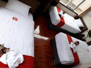 Postel nebo postele na pokoji v ubytování Pumas Cusco Hotel