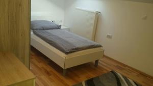 A bed or beds in a room at Apartma Rodica