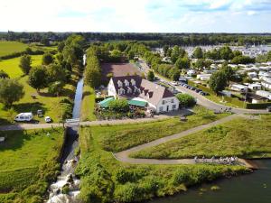 an aerial view of a small town next to a river at Hotel De Spaenjerd in Kinrooi