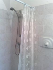 a shower with a shower curtain in a bathroom at Gallipoli centro in Gallipoli +64 photos