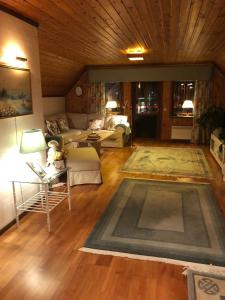 a living room with a couch and a table at Anitas B&B Stockholm/Vällingby in Stockholm +25 photos