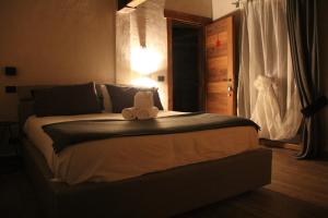 Postel nebo postele na pokoji v ubytování B&B Lo Matsòn