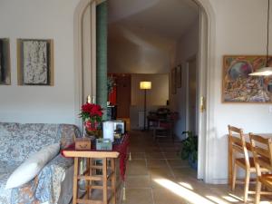 a living room with a couch and a table at Can Seuba in Rellinars