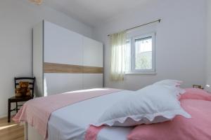 Postel nebo postele na pokoji v ubytování Apartmani Meriko