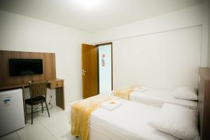 Cama ou camas em um quarto em Hotel Folley