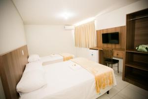 Cama ou camas em um quarto em Hotel Folley