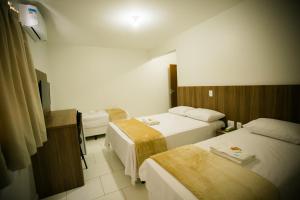 Cama ou camas em um quarto em Hotel Folley