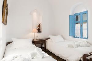 Voodi või voodid majutusasutuse Pantelia Suites toas