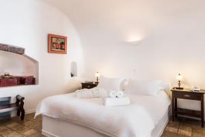 Voodi või voodid majutusasutuse Pantelia Suites toas