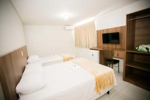 Cama ou camas em um quarto em Hotel Folley