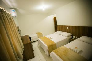 Cama ou camas em um quarto em Hotel Folley