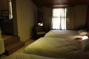 Postel nebo postele na pokoji v ubytování Kanaan Group Hotel