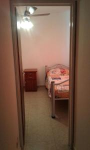 Una cama o camas en una habitación de Mendoza de sol