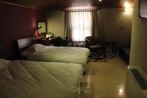 Postel nebo postele na pokoji v ubytování Kanaan Group Hotel