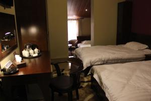 Postel nebo postele na pokoji v ubytování Kanaan Group Hotel