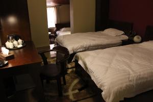 Postel nebo postele na pokoji v ubytování Kanaan Group Hotel