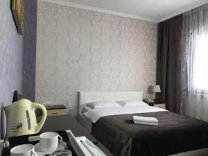 Postel nebo postele na pokoji v ubytování Mini-Hotel Pulsar