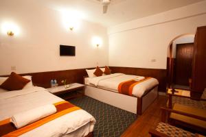 Ένα ή περισσότερα κρεβάτια σε δωμάτιο στο Jungle Safari Resort