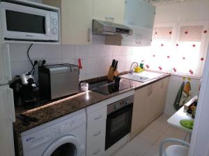 Una cocina o zona de cocina en Apartamento primera línea de mar
