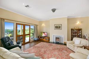 a living room with two couches and a fireplace at Lemon Grove in Montville