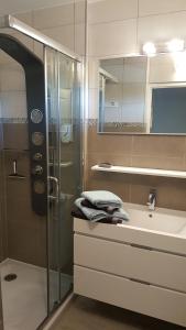 a bathroom with a shower and a sink at Résidence TROUVILLE in Châtelaillon-Plage