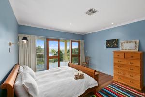 a bedroom with a bed with two shoes on it at Lemon Grove in Montville +25 photos