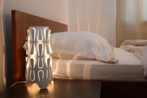 En eller flere senge i et værelse på Apartment Sommer