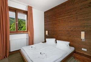 Letto o letti in una camera di Hotel Adam