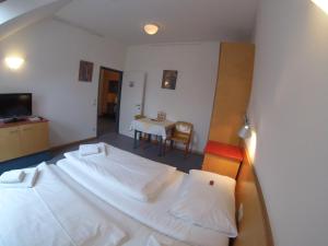 Postel nebo postele na pokoji v ubytování Haus Mobene - Hotel Garni