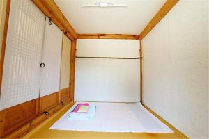 a small room with a bed in the middle at Dobong Seodang in Gyeongju