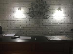 a dimly lit bathroom with a sink and a mirror at Albury Townhouse Motel in Albury