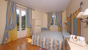 Postel nebo postele na pokoji v ubytování Villa Sofia Hotel + 28 fotografií